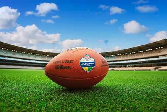NFL ball on the turf at the MCG.