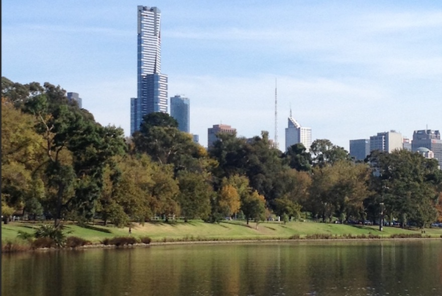 Yarra River parklands and city buildings viewed from the river.
