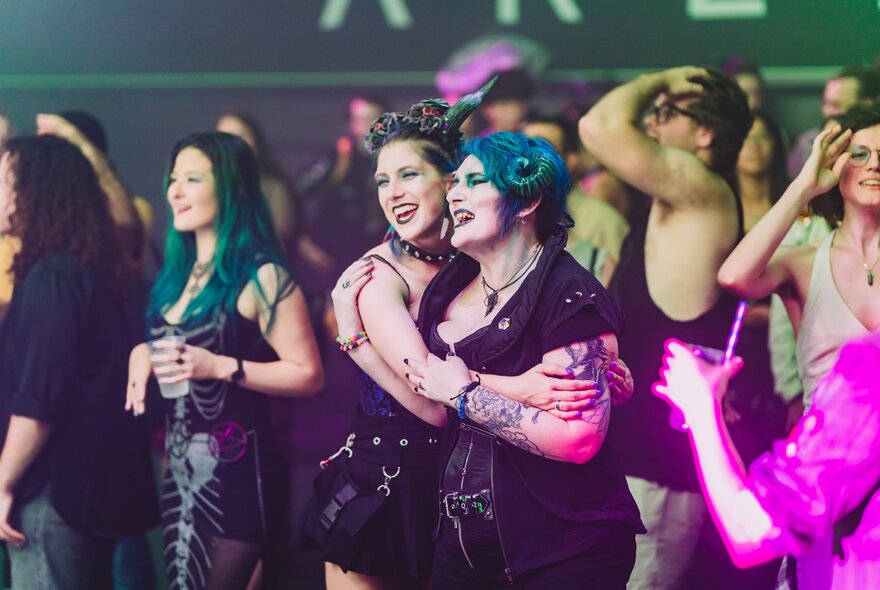 Eventgoers in cosplay outfits.