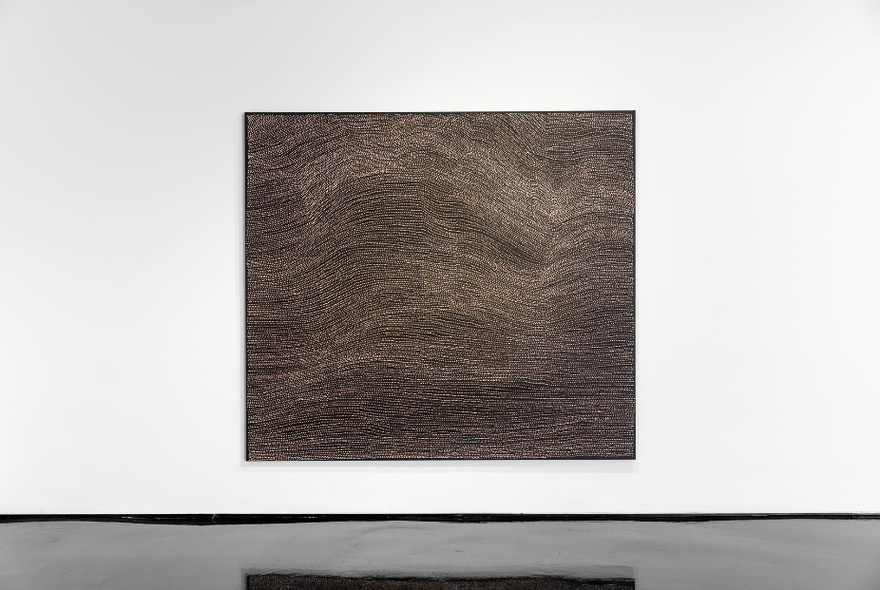 A large square contemporary painting hanging on a white wall in a gallery.