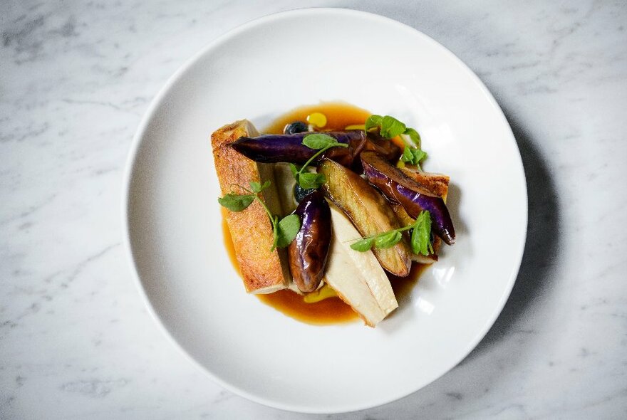 Plate of food on a restaurant table.