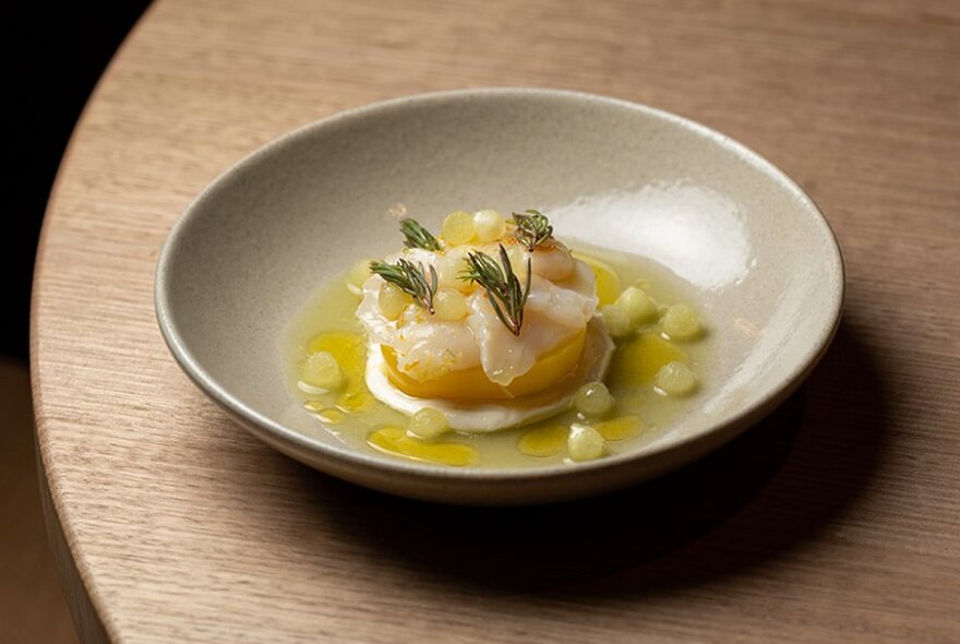 A dish of restaurant food, artfully arranged in a low bowl.