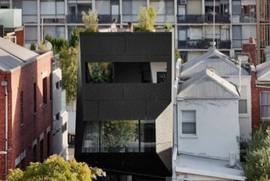 South Yarra streetscape viewed from behind with a mix of modern and Victorian architecture.