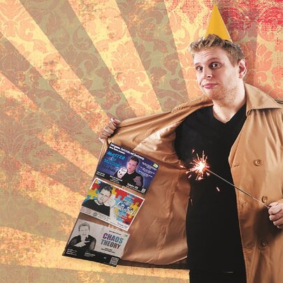 A man holding open a trench coat with picture of himself inside with a magic wand in the other hand and a sun ray background. 