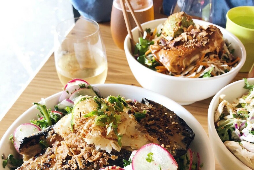 Table full of bowls of food.