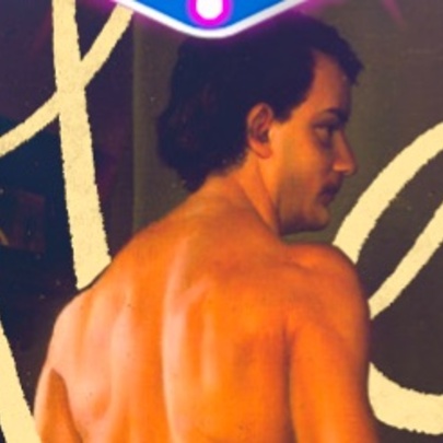 Naked back of a man facing a wall of text.