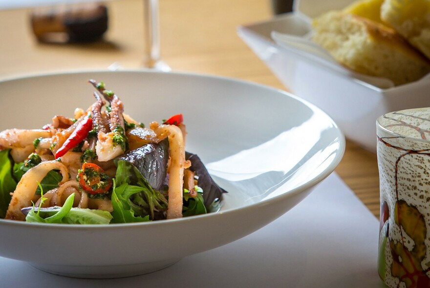 White bowl of seafood salad.