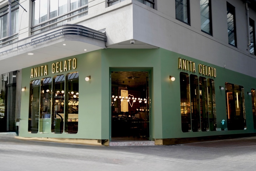 The green building exterior of Anita Gelato on a Melbourne city street corner.