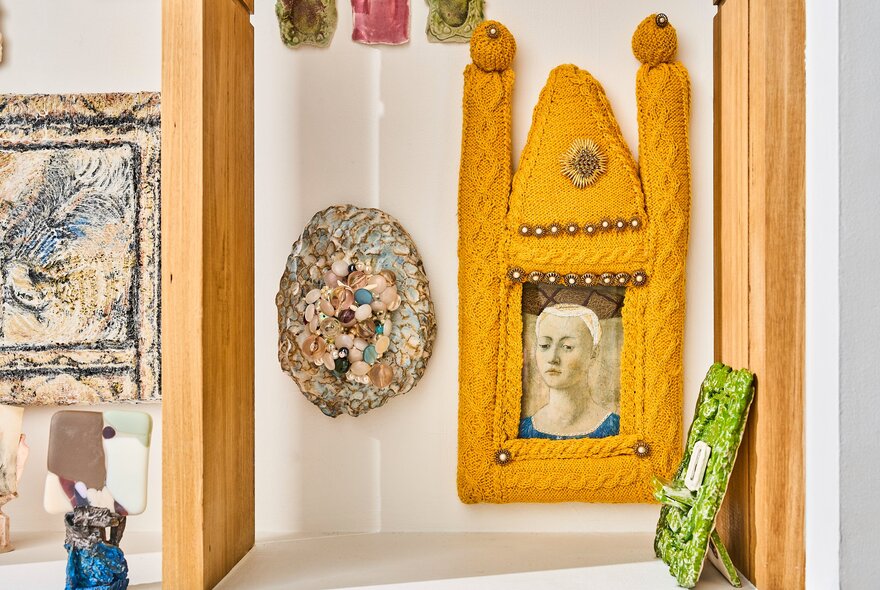 Small framed artworks on display on the white walls of the gallery space at Craft.