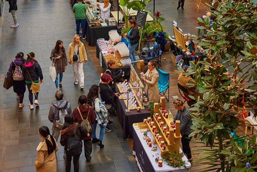 People browsing market stalls, taken from above.