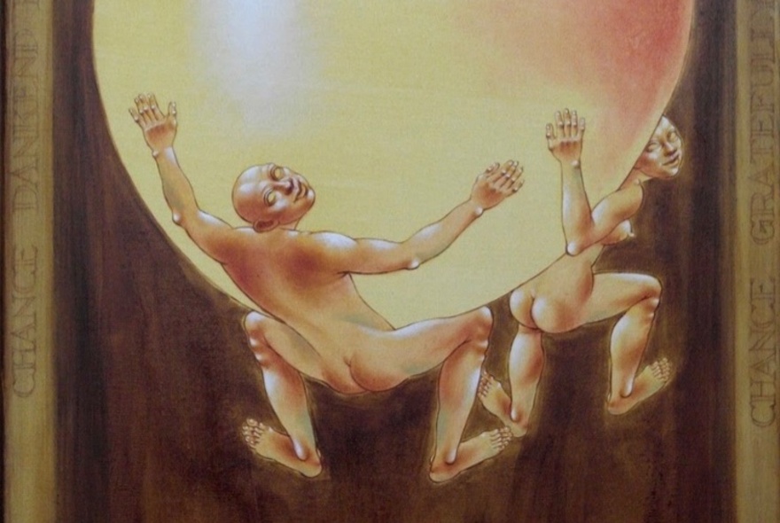 Artwork depicting naked men astride a golden globe.