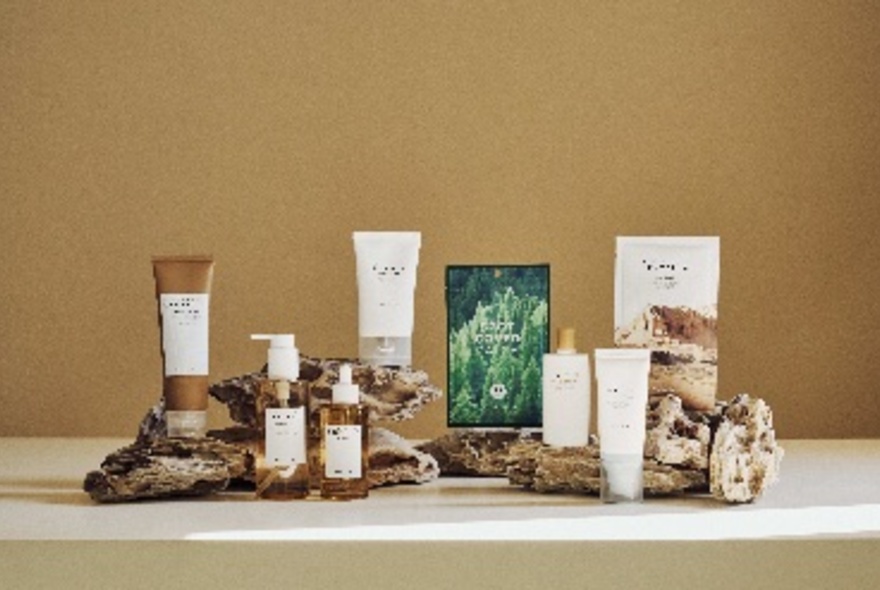 A selection of packaged beauty and skincare products displayed on a table.