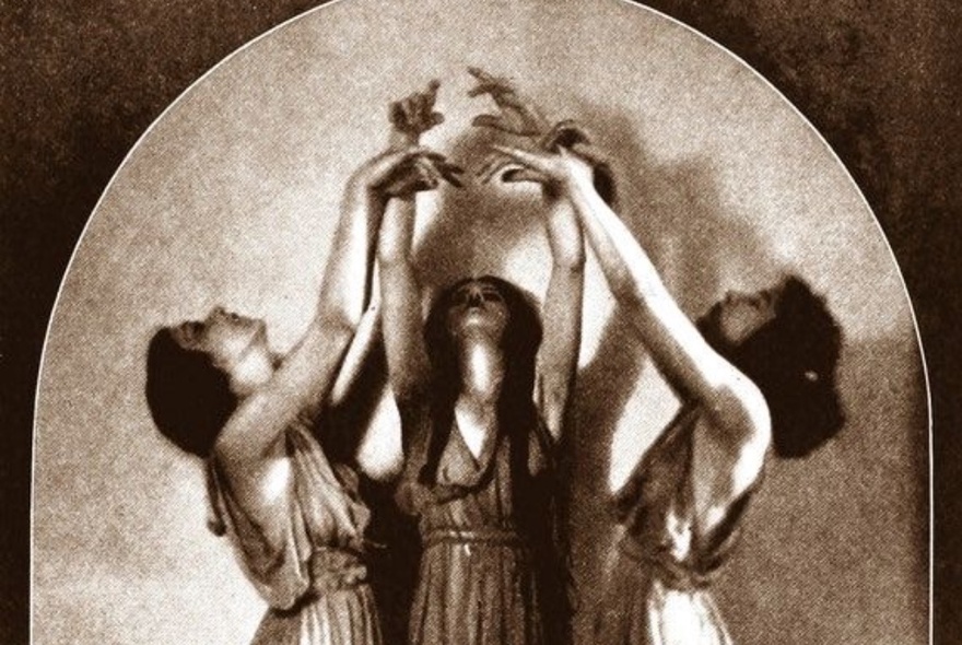 Illustration of three women wearing classical greek style tunics, their heads leaning back and arms uplifted with hands touching.