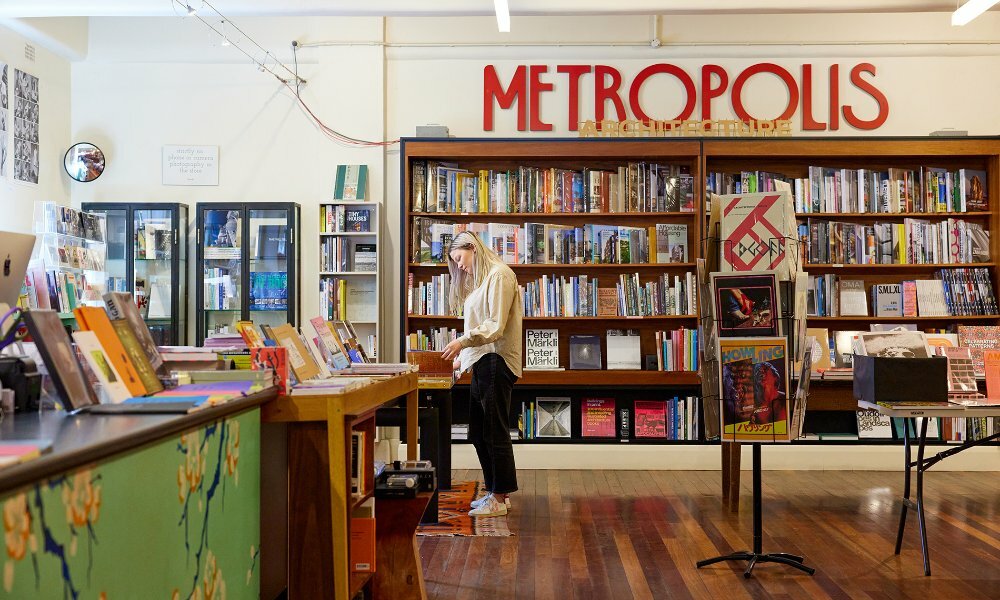 A woman browsing in a book store.