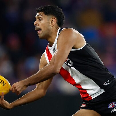 St Kilda AFL football player with the ball during a match.