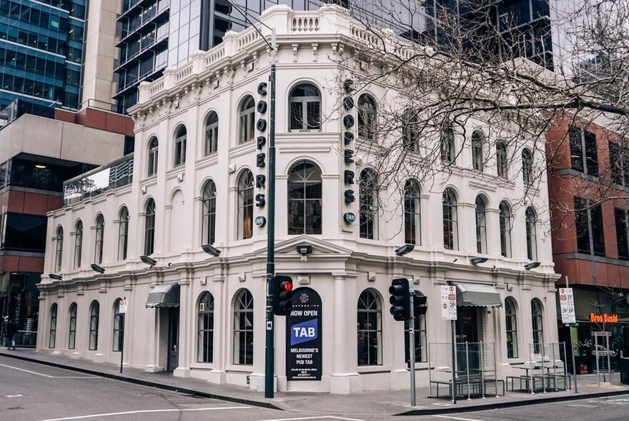 Exterior of the Coopers Inn building, situated on a street corner.