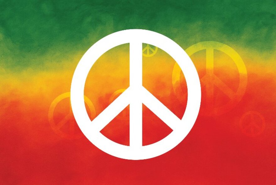 A white peace symbol against a green, yellow and red background.