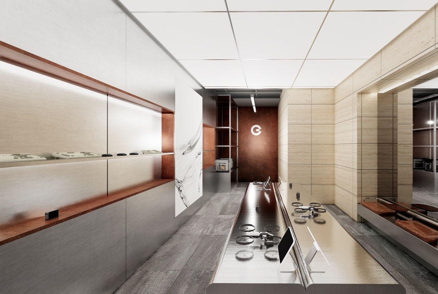 Interior of SilkGear store, featuring a sleek modern design with wood, tile and metal elements, and a table in the centre of the space. 