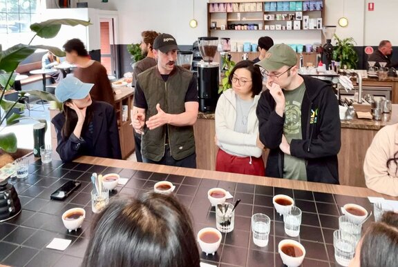 A group of people learning about coffee.