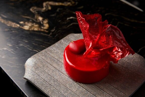 Red dessert served on a tray at Warabi restaurant.