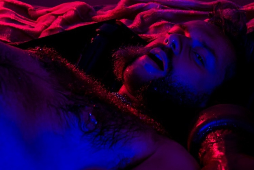 Textural landscape shaded in red and purple.