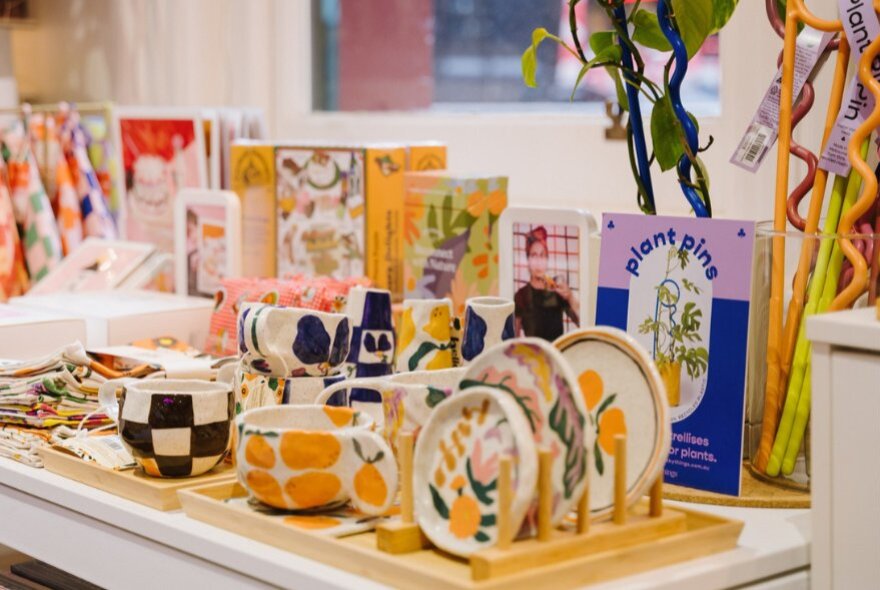 Goods on display including ceramics and cards, inside the Queen Victoria Women's Centre SHOP!