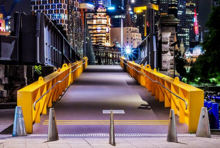 The brightly lit entrance to Sandridge Bridge by night.