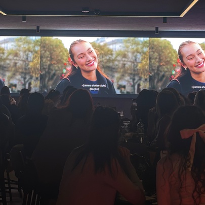 Three side-by-side television screens showing the same scene from a television show and being watched by an audience of women.