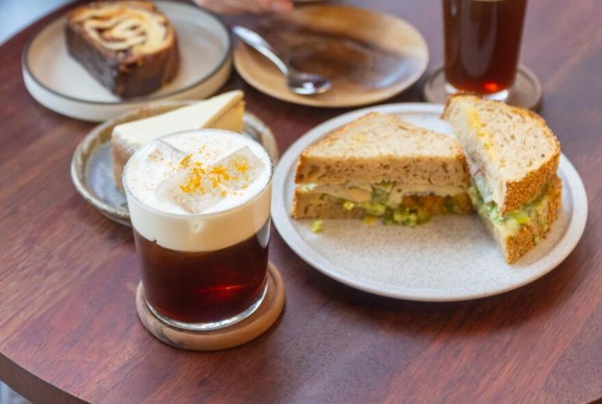 Creamy beverage next to a sandwich