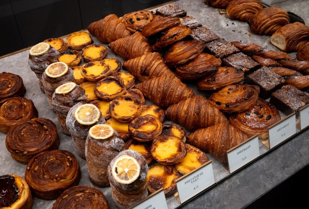 Polished concrete display shelf covered in pastries.