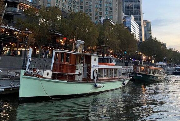 A green bottomed steam boat moored at Southbank on the Yarra River