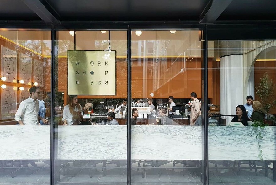 Large windows with view through to Workshop dining space.