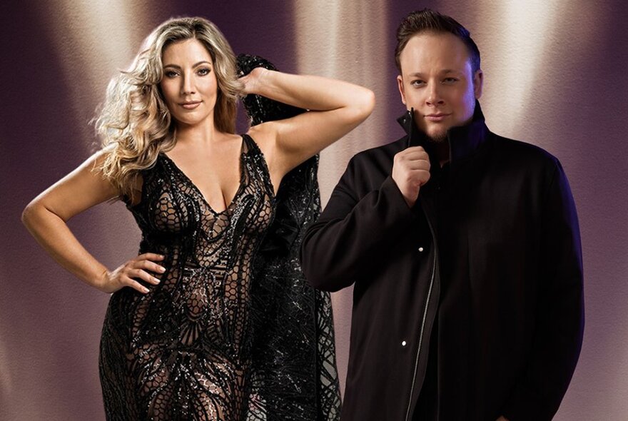 Diva female singer and moody male vocalist dressed in black against a beige-lit background.