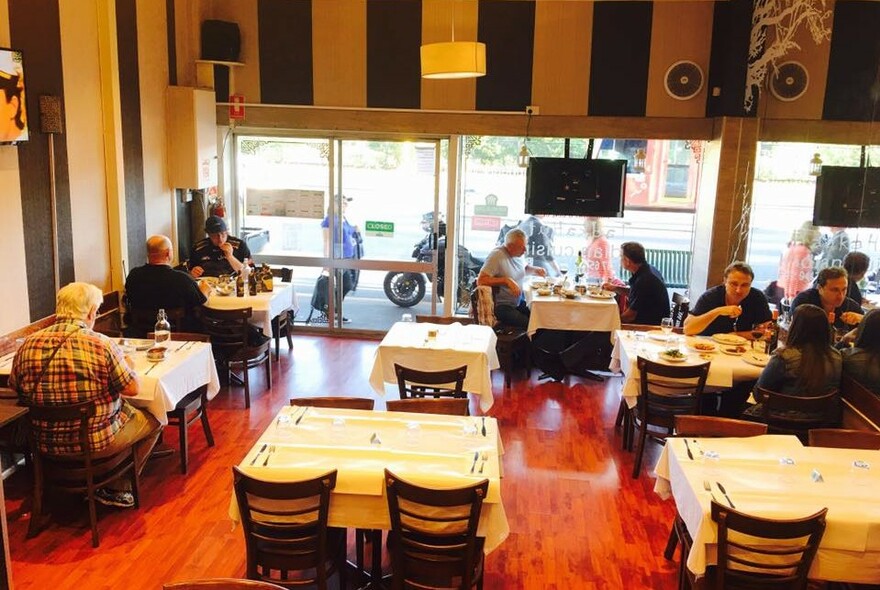 Interior shot looking down on the dining area of Tadka Hut Indian Restaurant.