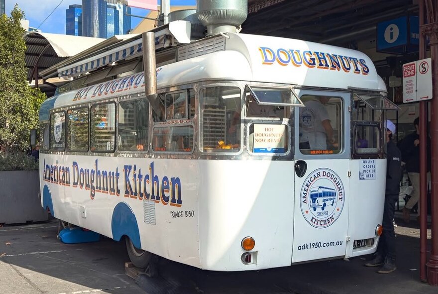 A blue and white doughnut van.