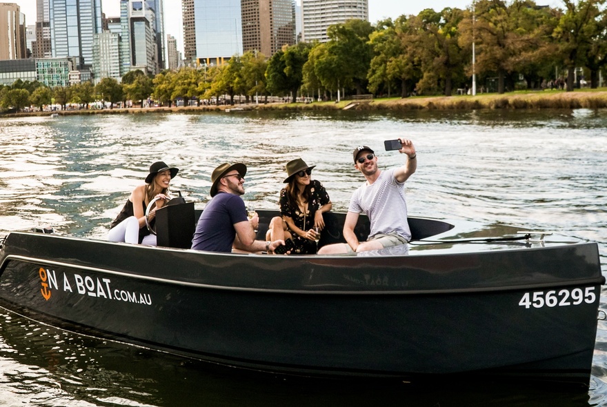 A group of people on a small boat on the Yarra River in Melbourne.