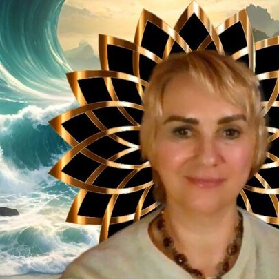 Blonde woman with dark eyebrows with lotus halo and waves crashing in the background.