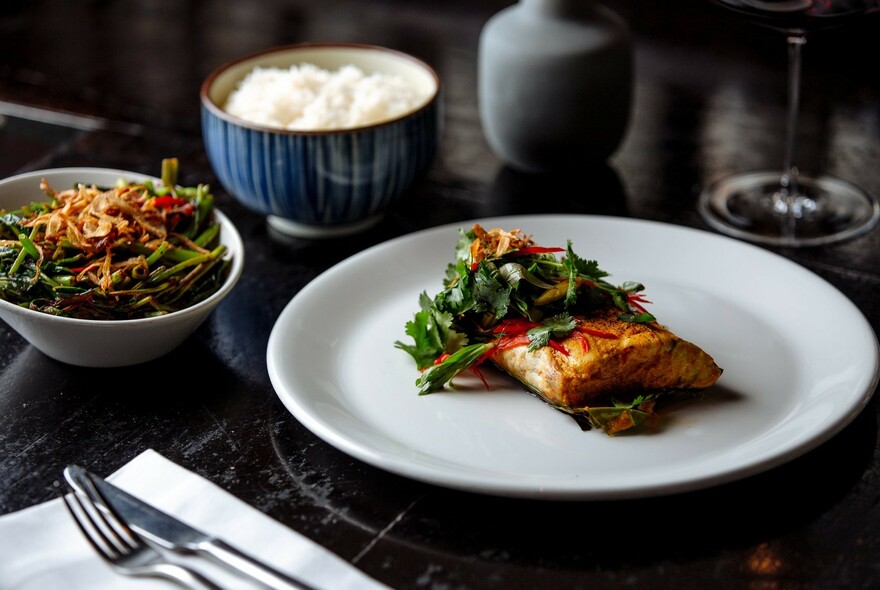 Small plate of food and a side salad.