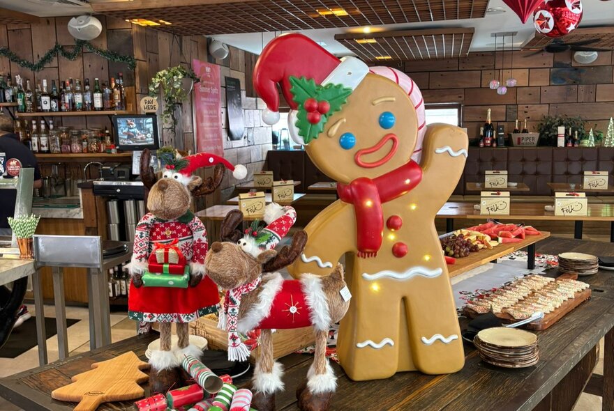 A large gingerbread man and various other Christmassy items.