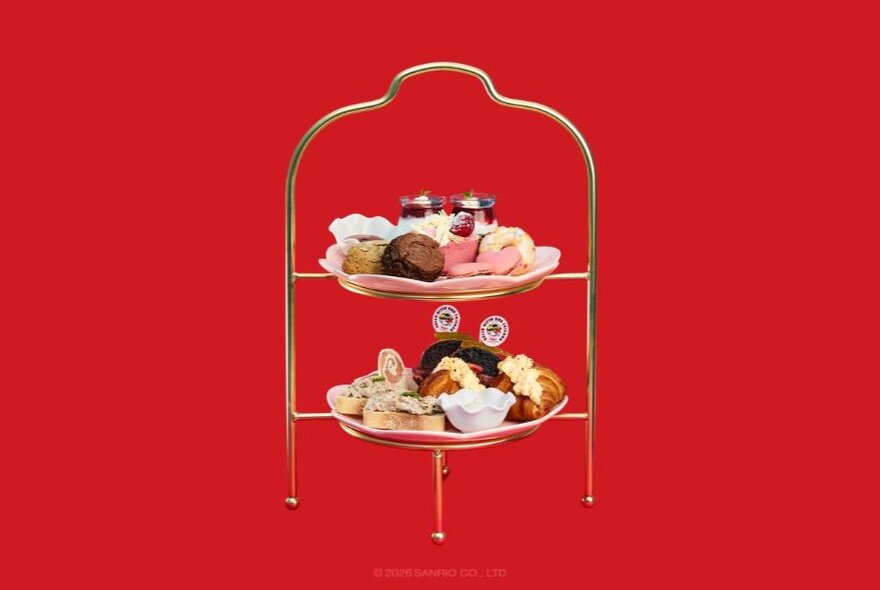 A tiered High Tea plate of savoury and sweet food served at Hello Kitty and Friends cafe.