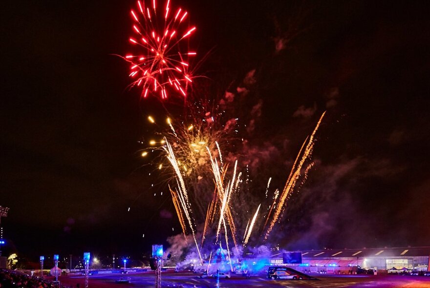 Fireworks exploding in the night sky at the Melbourne Royal Show.