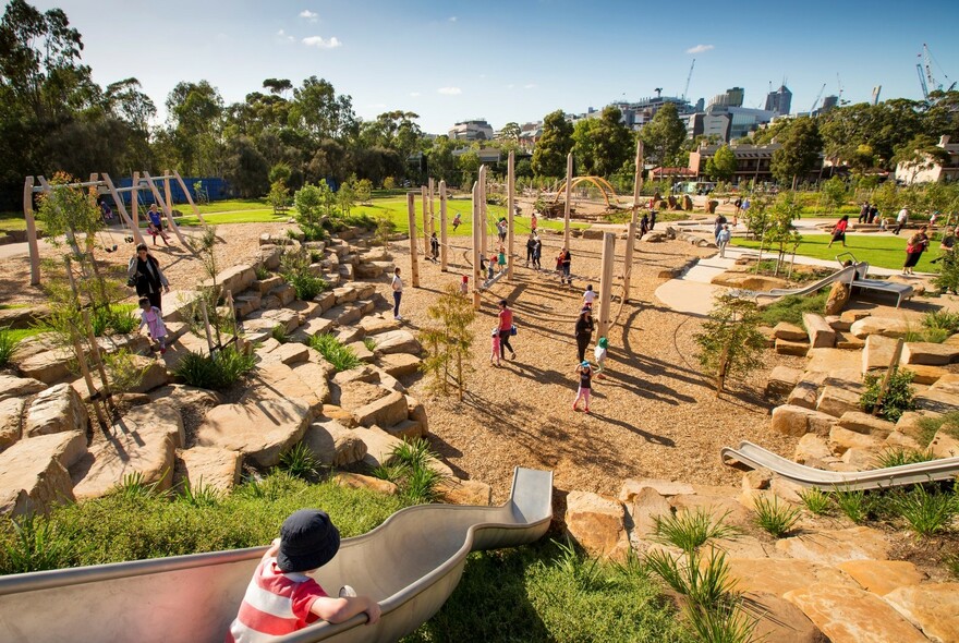 Child on slide in playground at Royal Park.