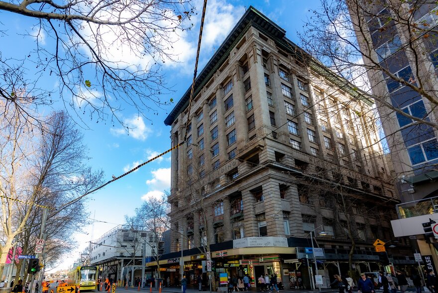 The exterior of a 1920s building on a busy city street