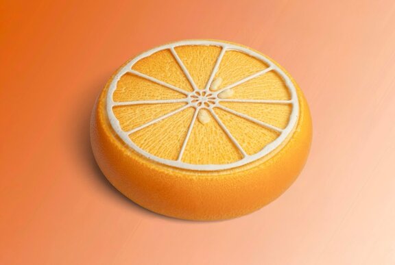 A yellow circular cake resembling a slice of the citrus fruit kumquat.