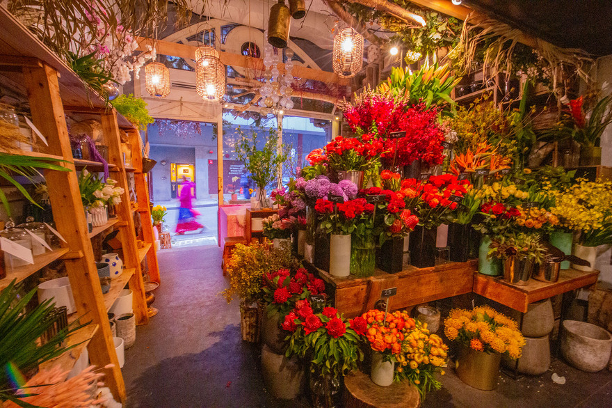 A colourful display of flowers in a shop.