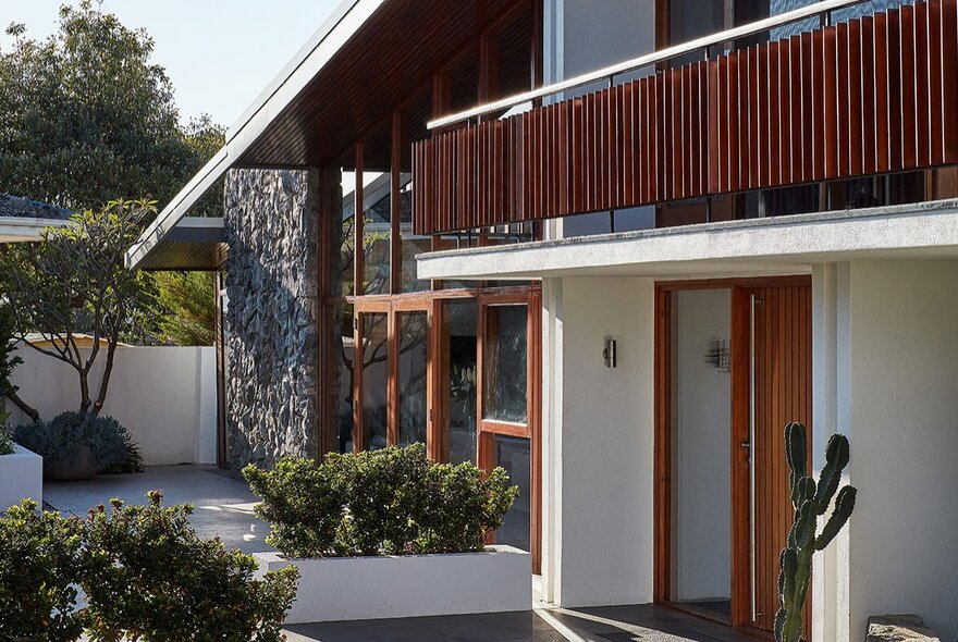 An example of modernist Pacific Rim architecture with white walls and timber features.