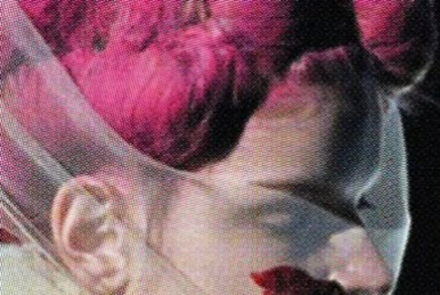 Rei Kawakubo model with chiffon and purple wig.