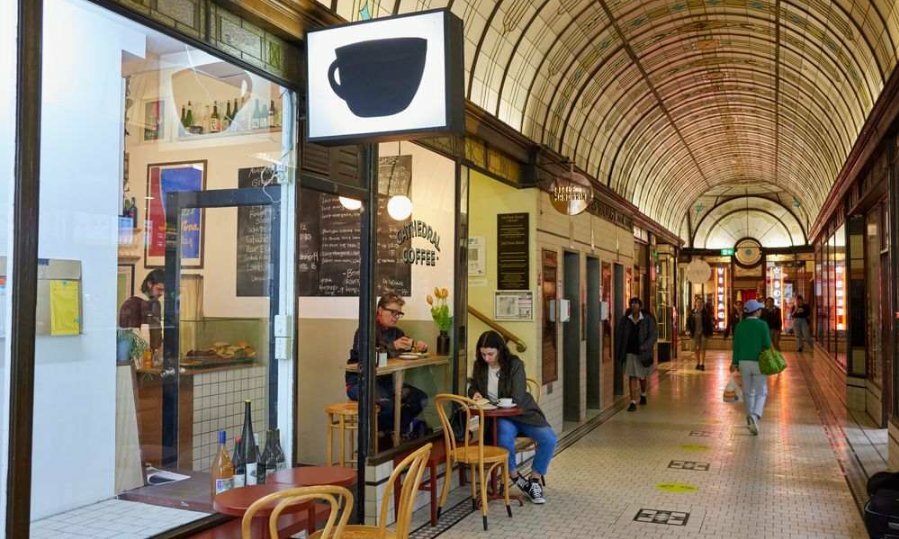 People drinking coffe in an arcade