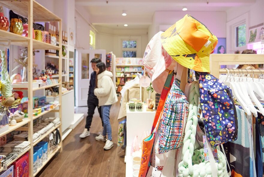 Customers browsing the goods on display inside Queen Victoria Women's Centre SHOP!