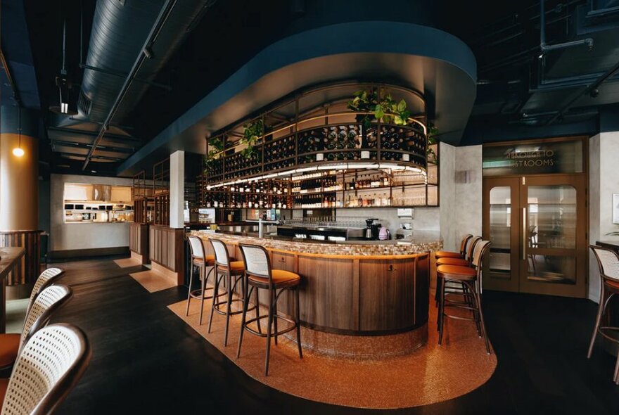 Interior of Central Club Hotel showing curved art-deco bar.